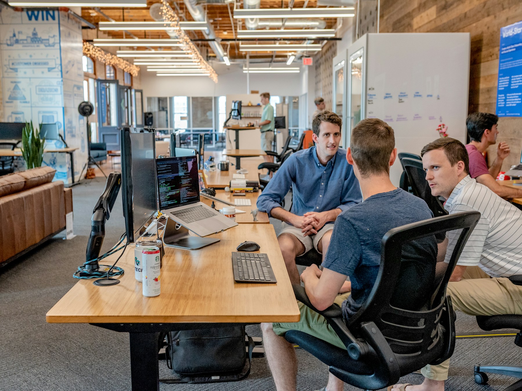 A confident service team collaborating in a bright office