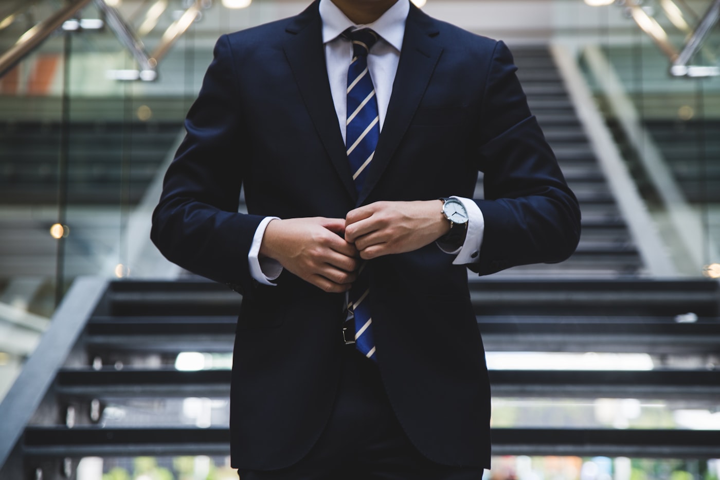 A business leader standing confidently in a city setting